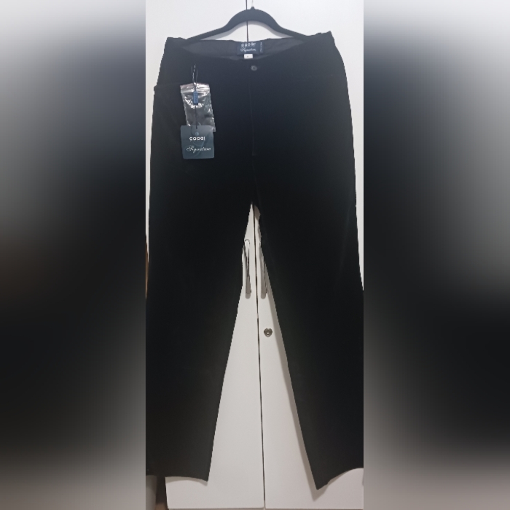 Coogi brand black vintage pants with a printed design.